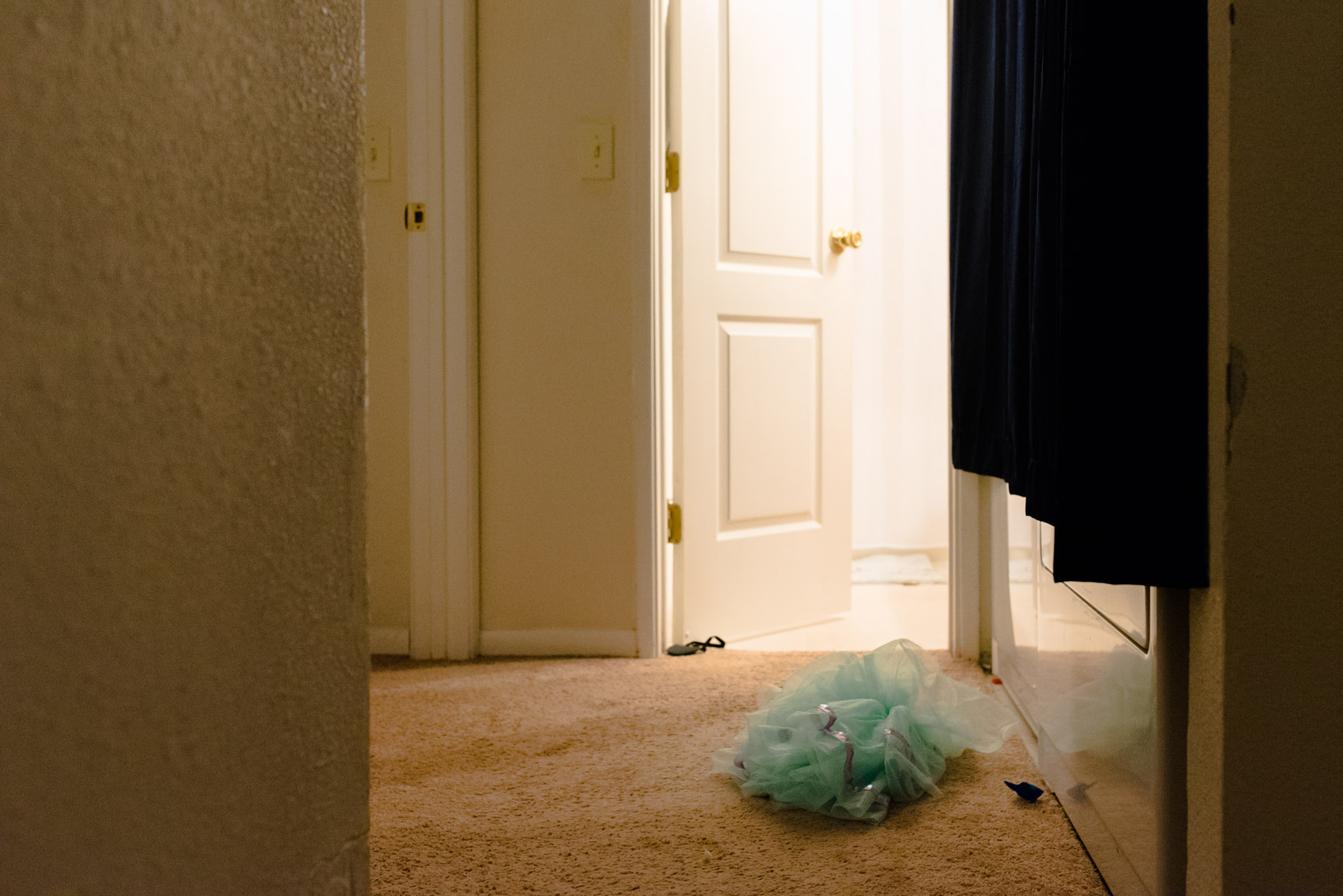 tutu left in hallway - documentary photography military families