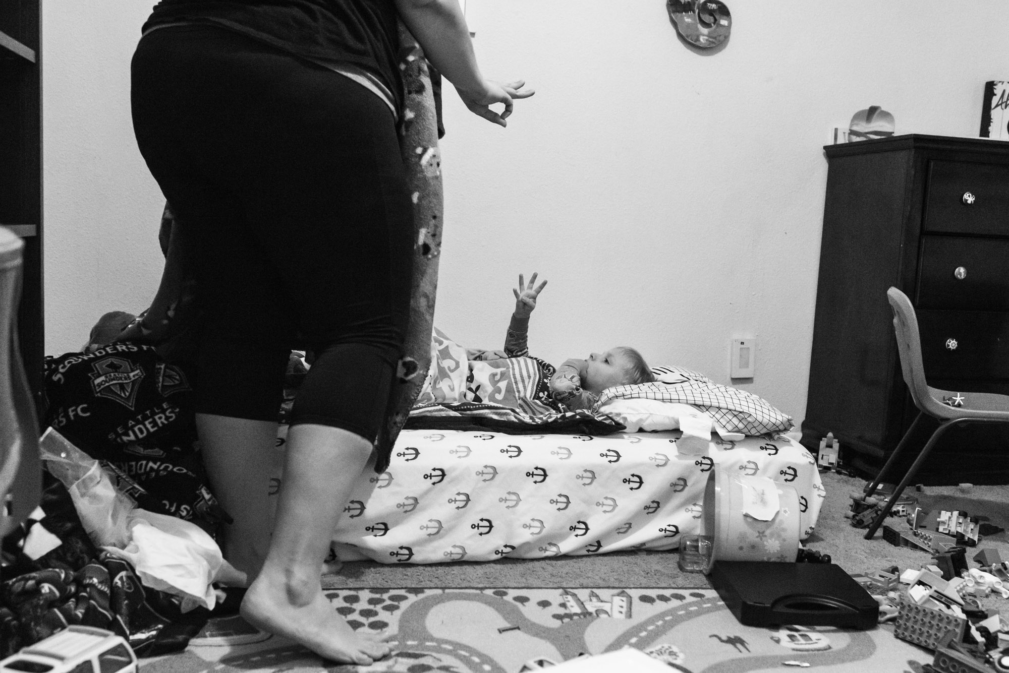 mother and son discuss number of blankets - documentary photography military families