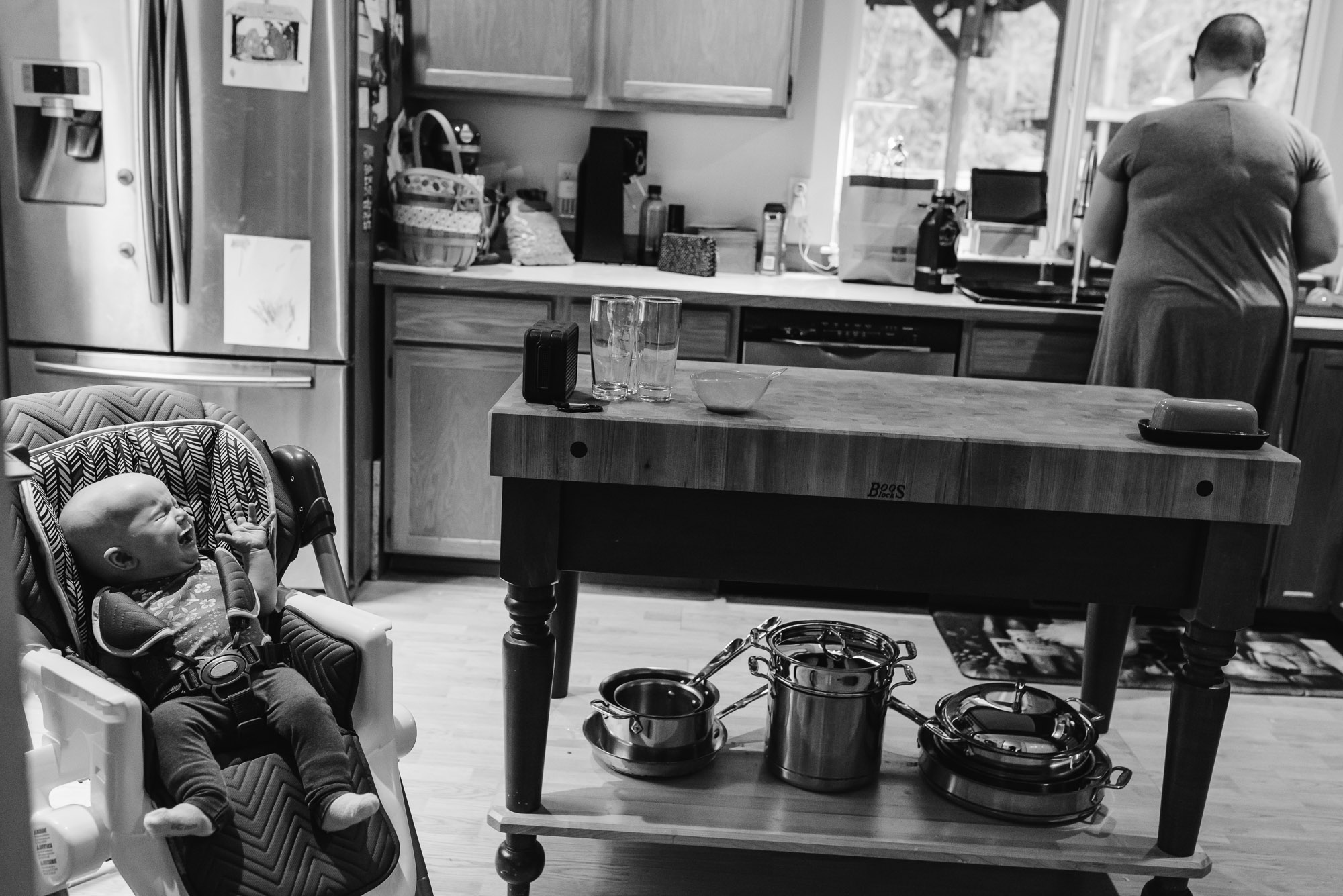 baby is impatient for formula - documentary photography of military families