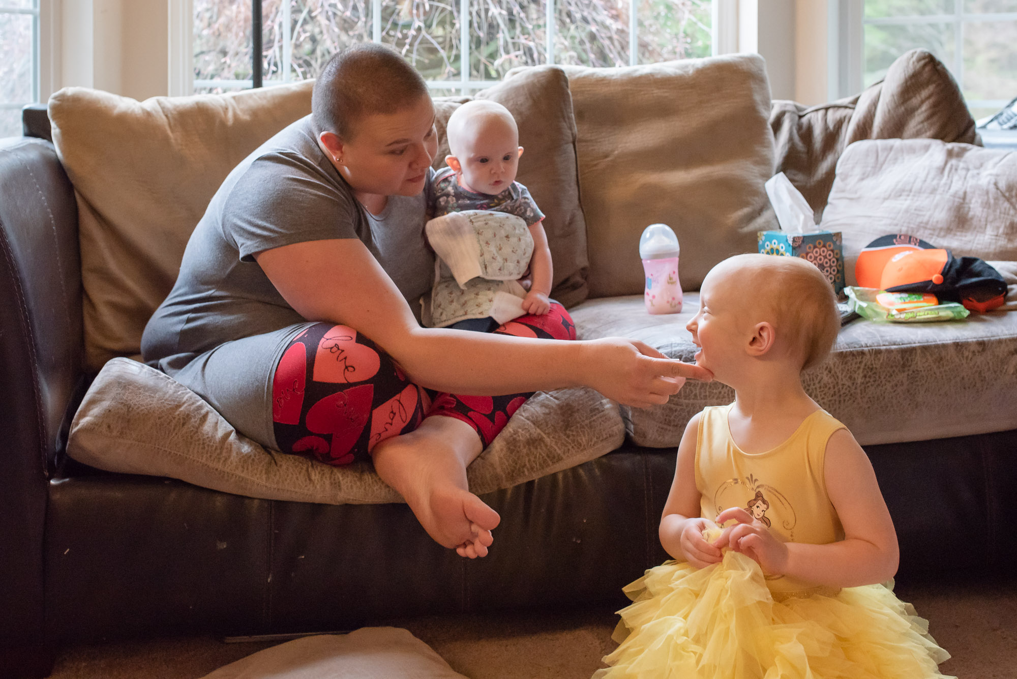 mother gently scolds daughter - documentary photography of military families