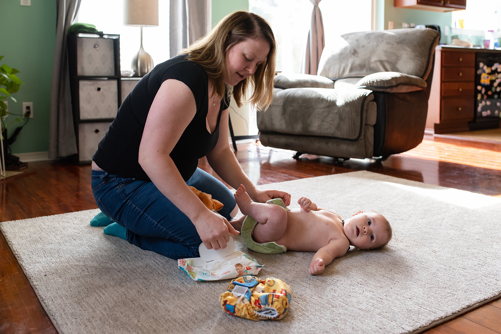 mom changes diaper