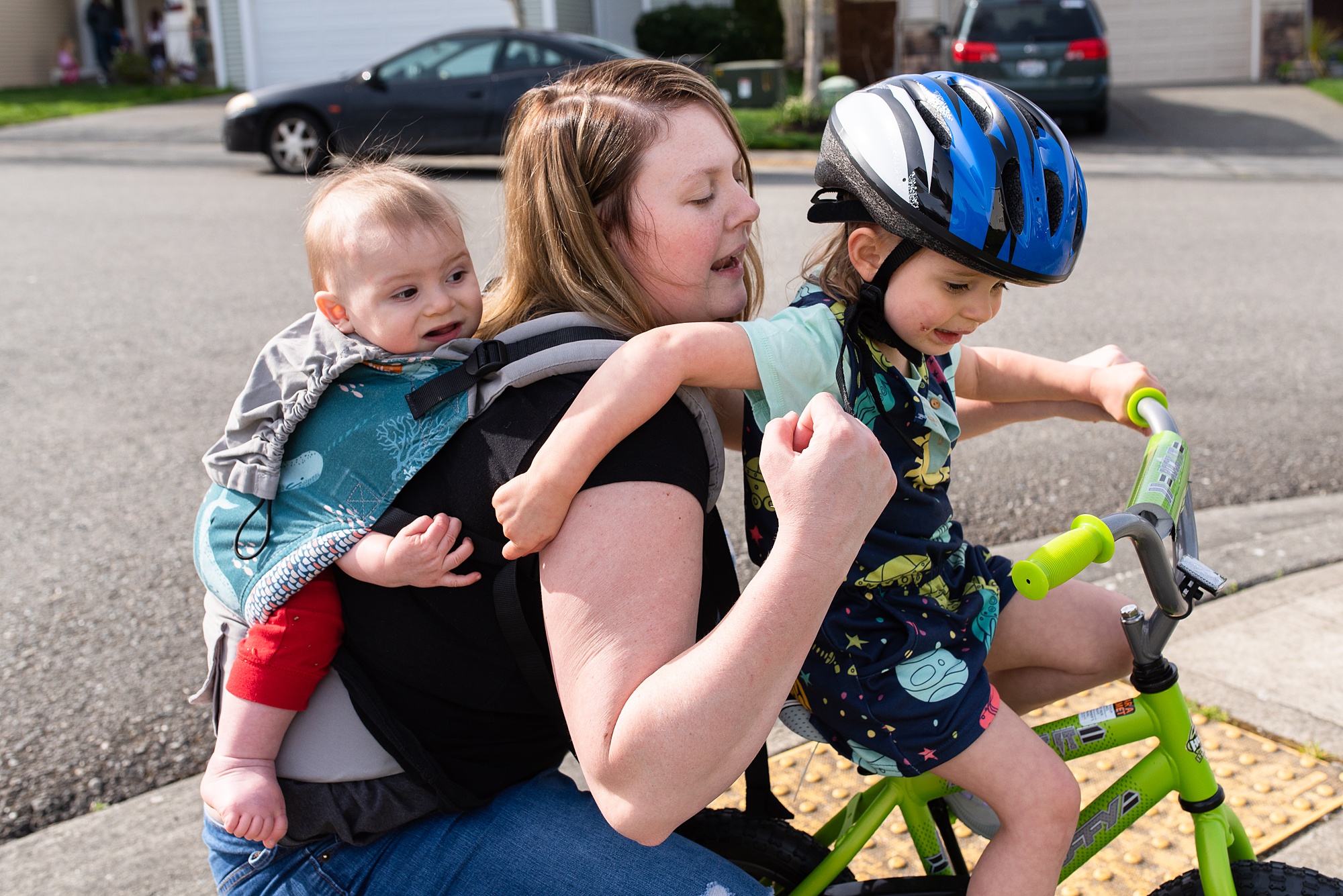 mom encourages daughter on bike