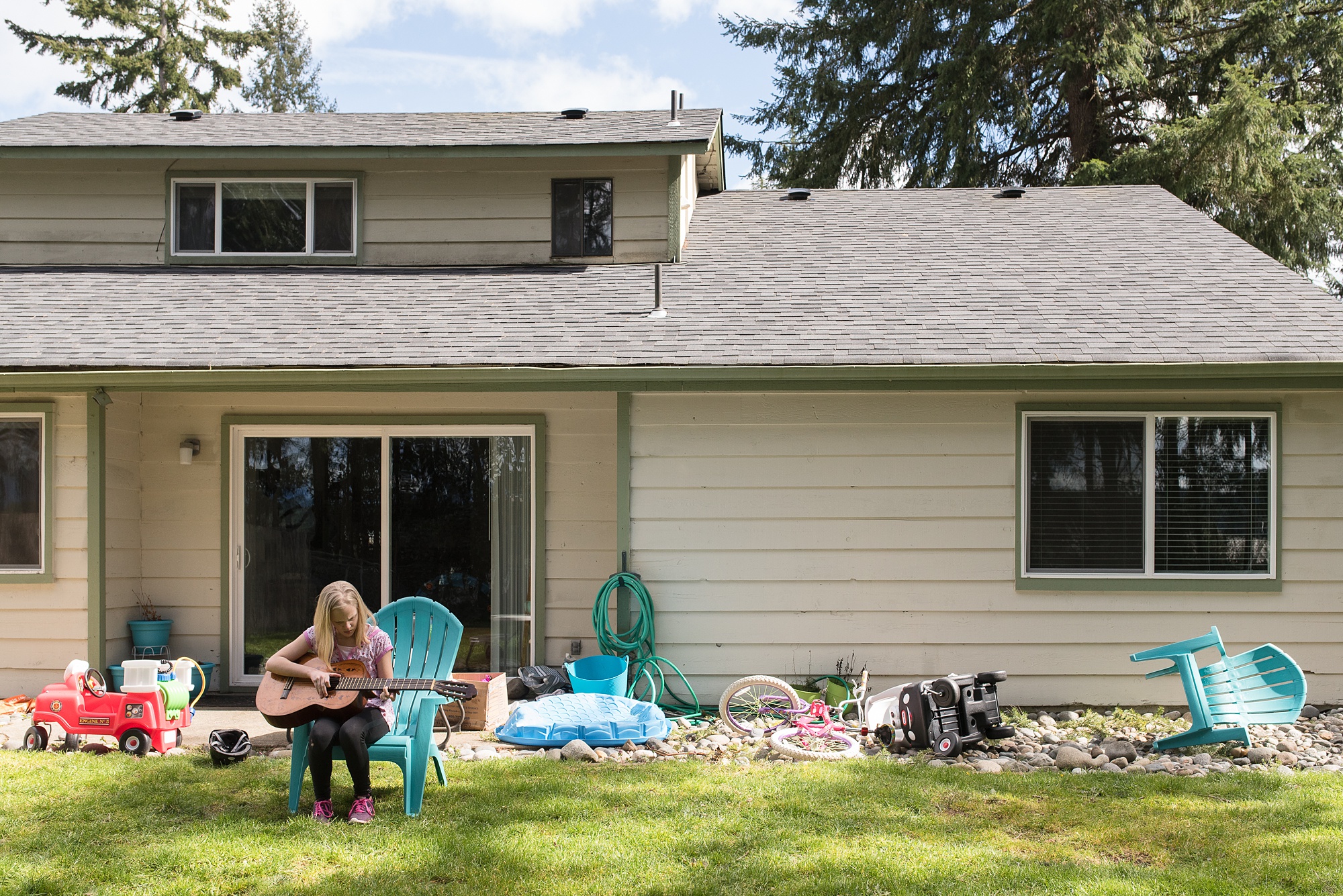 girl with guitar in back yard - military family photography