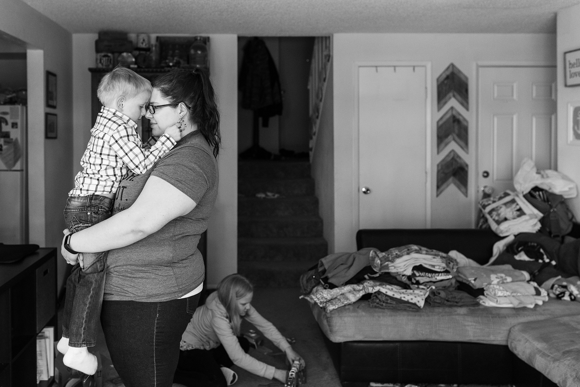 mom comforts boy - military family photography