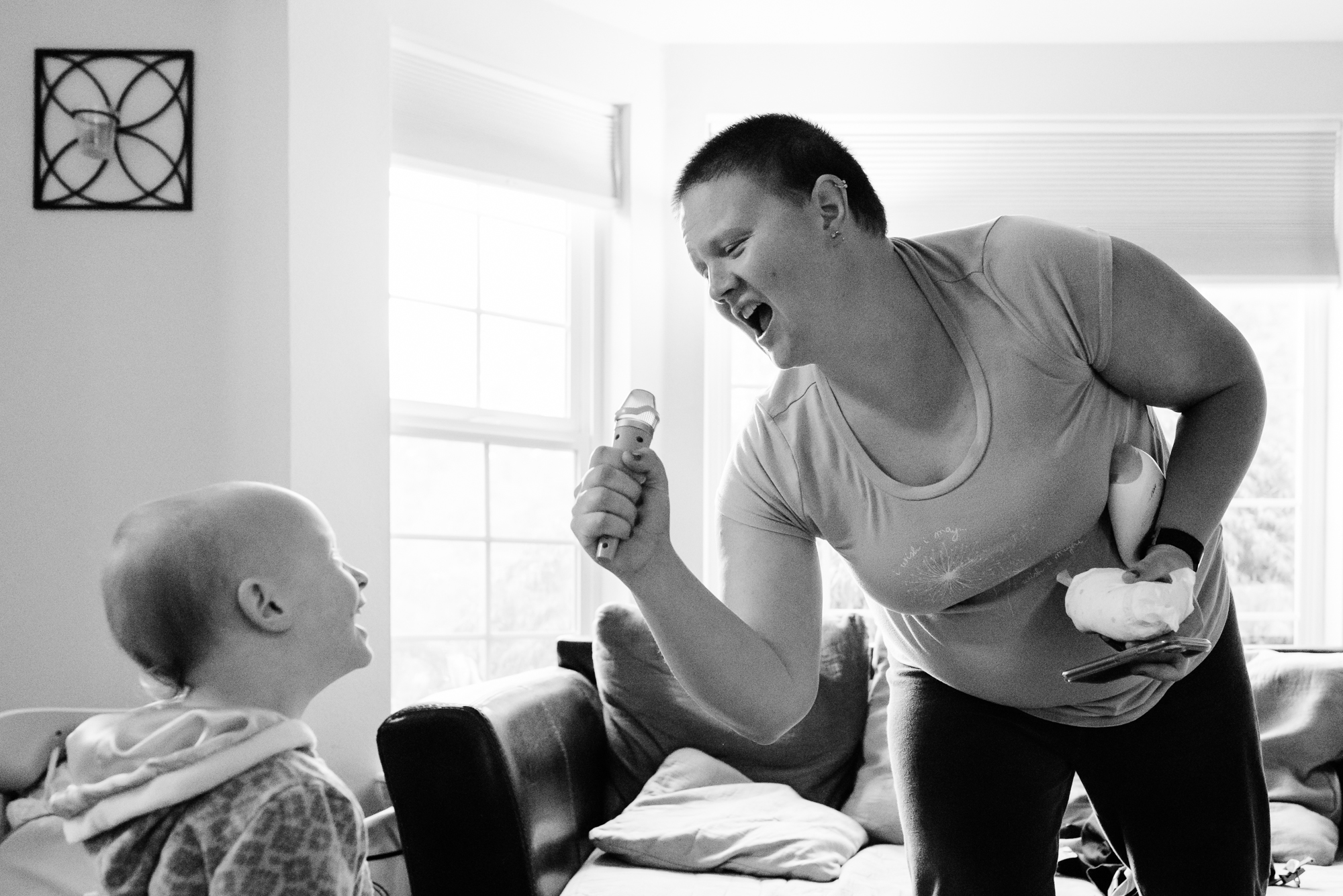 mom sings to daughter in toy microphone