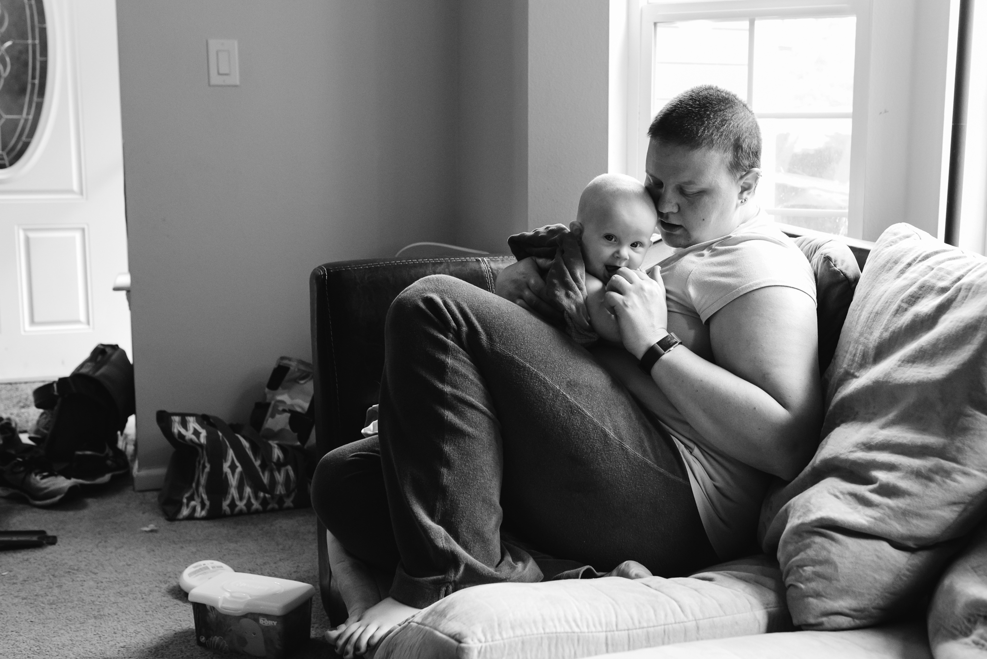 mom snuggles baby